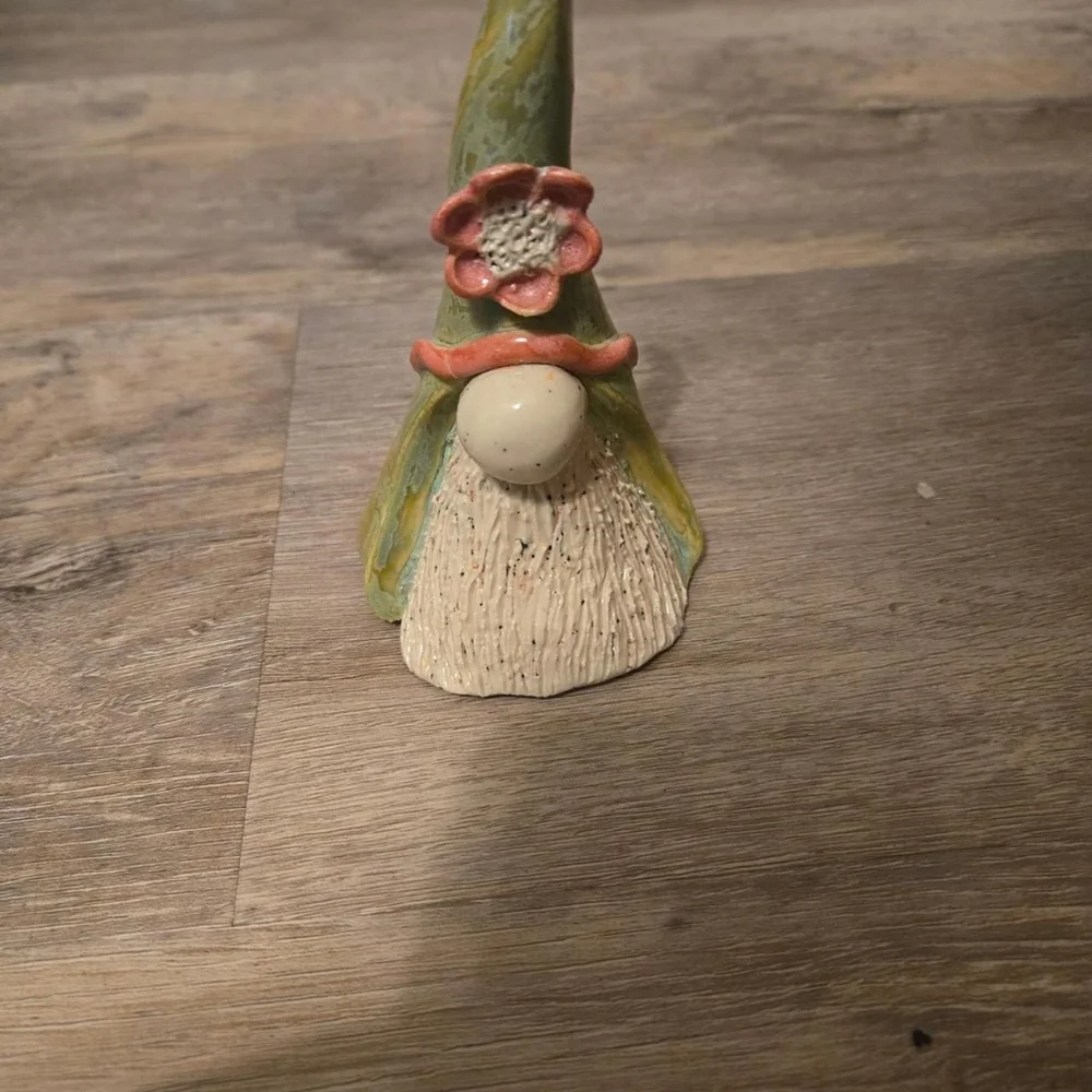 Small green gnome sculpture